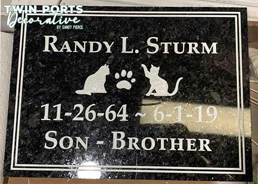 sandblasted and paint filled black quartz headstone