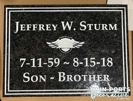 sandblasted and paint filled black quartz headstone