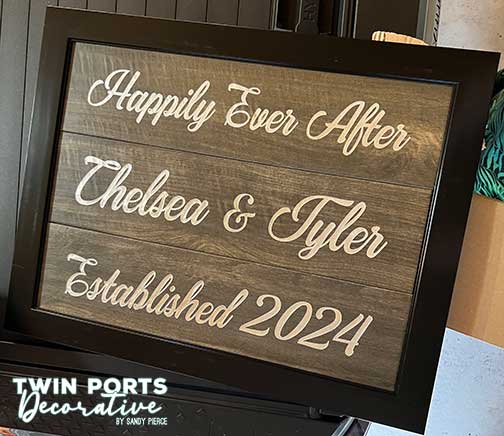 woodgrain tiles sandblasted and paint filled framed in frame