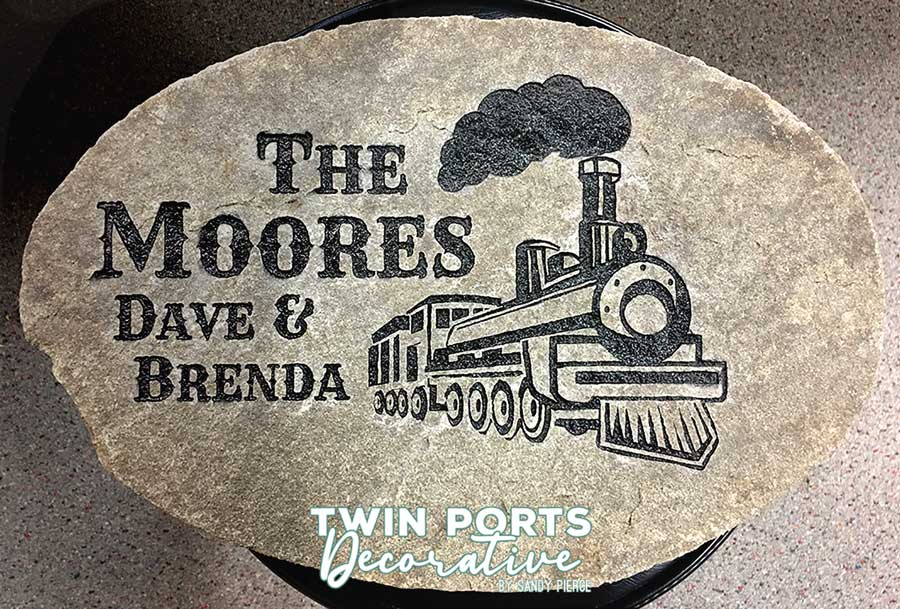 cement round step paver sandblasted with names and train artwork